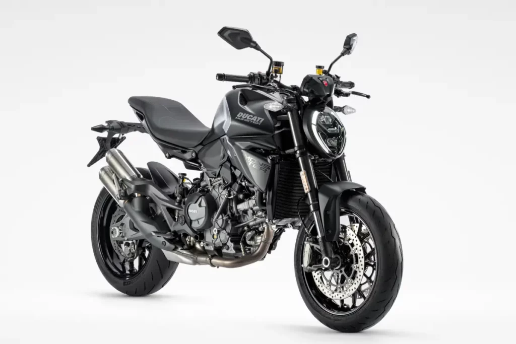 Ducati Monster Dark 2027 vista en tres cuartos delantero sobre fondo blanco